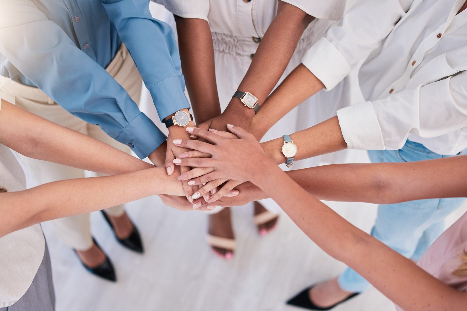 United, successful or ambitious business people hands stacked together in a work office